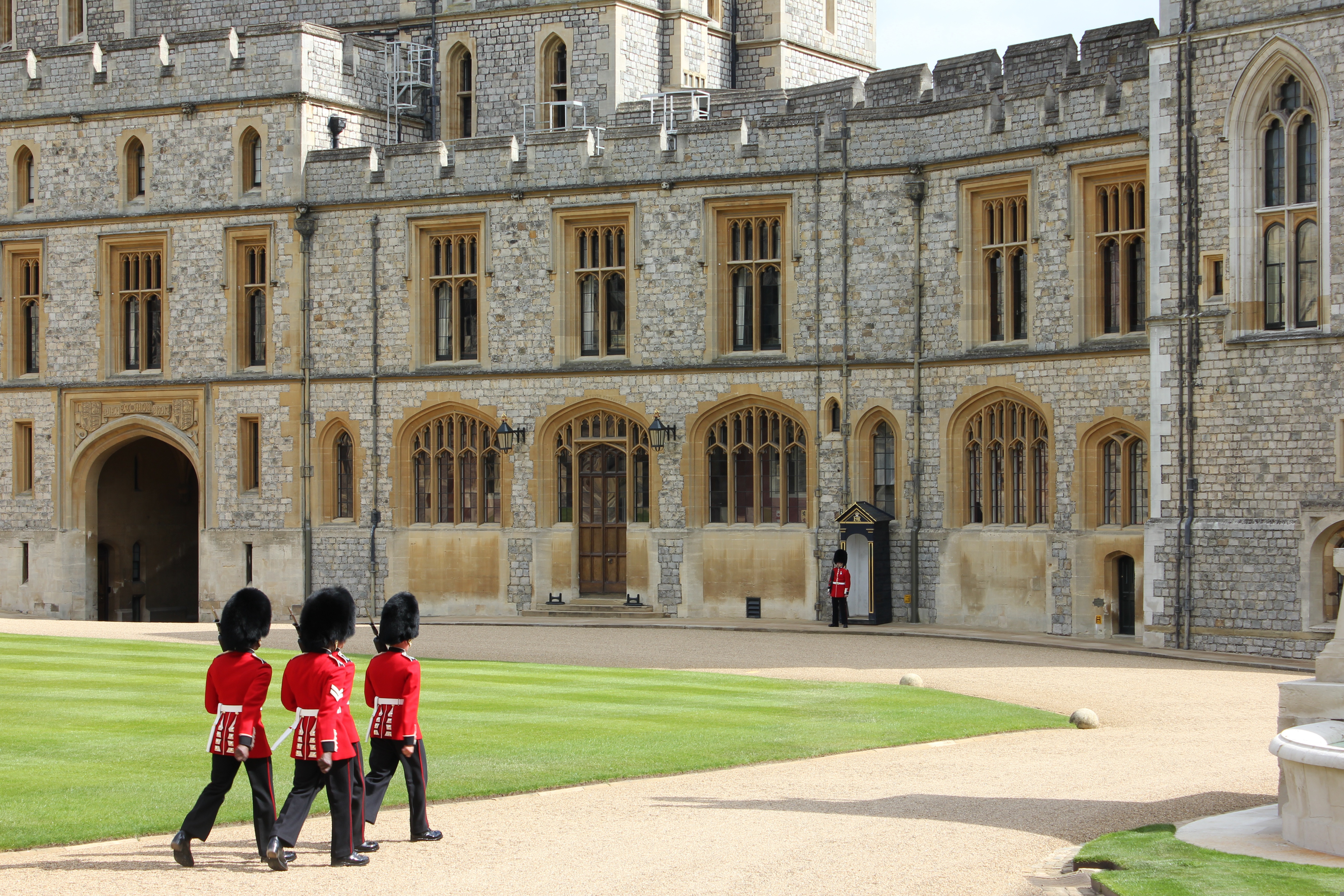 A very big building with guards walking around